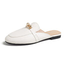 Genuine leather closed-toe mule slippers for women, perfect for wearing outside.