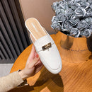 Genuine leather closed-toe mule slippers for women, perfect for wearing outside.