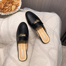 Genuine leather closed-toe mule slippers for women, perfect for wearing outside.