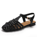 New style woven pig cage openwork sandals, vacation style, fashionable open toe, low heel, flat sole, one-strap Roman sandals 1012-3