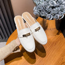 Genuine leather closed-toe mule slippers for women, perfect for wearing outside.